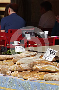 Fresh batard bread and baguettes for sale in open market in Sarlat France