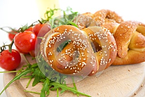 Fresh Bavarian Pretzel on Wooden Table over white background