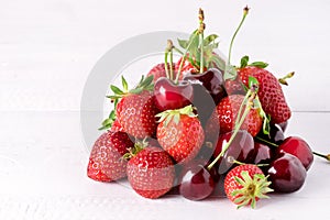 Fresh Beautiful Ripe Berries on a White Wooden Background Sweet Strawberries and Cherry Copy Space