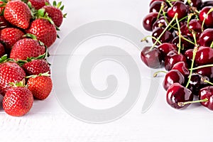 Fresh Beautiful Ripe Berries on a White Wooden Background Sweet Strawberries and Cherry Frame Copy Space