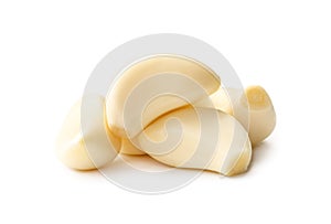 Fresh beautiful whole peeled garlic cloves in stack isolated on white background with clipping path