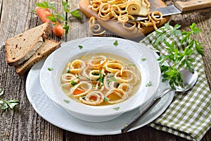 Fresh beef bouillon with strips of pancake