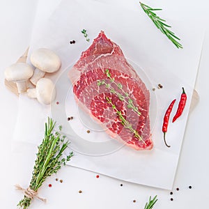 Fresh beef fillet with ingredients in cooking