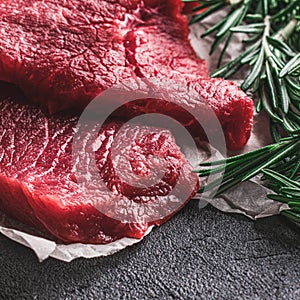 Fresh beef meat, raw beef steak with a sprig of rosemary. Healthy food