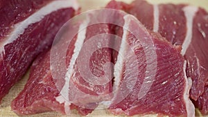 Fresh beef is sliced on natural background.