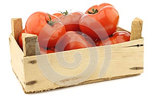 Fresh beef tomatoes in a wooden crate