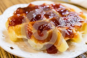 Fresh Belgian liege waffle with strawberry jam