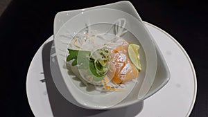 Fresh belly salmon sashimi raw on traditional Japanese plate