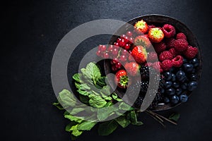 Fresh berries in bowl, antioxidant concept