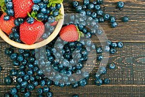 Fresh Berries on Rustic Wooden Background