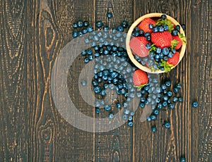 Fresh Berries on Rustic Wooden Background