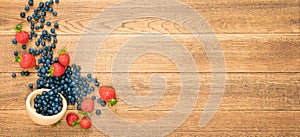 Fresh Berries on Rustic Wooden Background