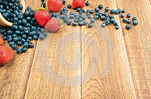 Fresh Berries on Rustic Wooden Background with Copyspace