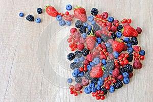 Fresh berries on wooden background