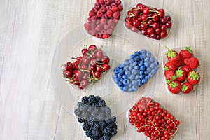 Fresh berries on wooden background