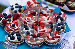 Fresh berry cakes with cream.