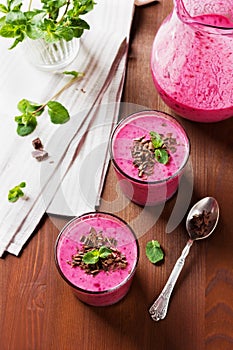 Fresh berry smoothie, milkshake, yogurt, dessert decorated grated chocolate