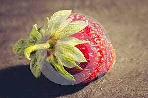 Fresh berry of strawberry on black table/Strawberry. Fresh berry of strawberry on black table. Closeup