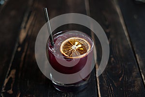 Fresh berry summer cocktail with citrus slice