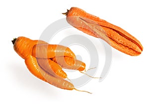 Fresh big red carrot cracked and fancy in shape on a white background