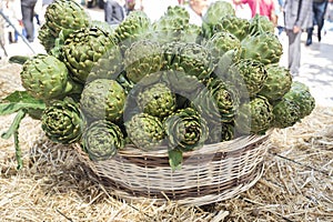 Background of fresh artichokes. Background of fresh artichokes. Fresh artichokes on display at the farmers` market for sale.