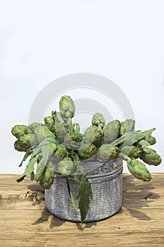 Background of fresh artichokes. Background of fresh artichokes. Fresh artichokes on display at the farmers` market for sale.