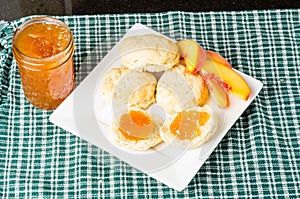 Fresh biscuits with peach jam