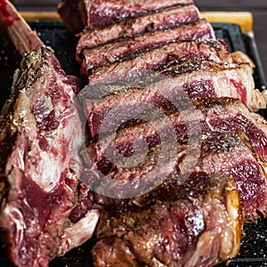 Fresh Bistecca alla Fiorentina on dark background photo