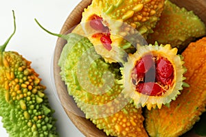 Fresh bitter melons on white table, top view