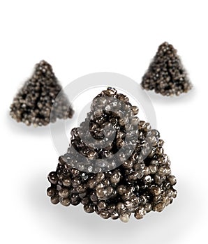 Fresh black caviar pyramid on white background