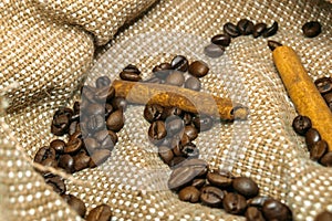 Fresh black coffe beans on cork table