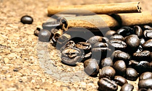 Fresh black coffe beans on cork table