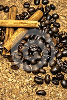 Fresh black coffe beans on cork table