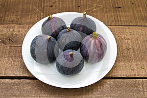 Fresh black figs age paintings, fresh fig fruit in dish,