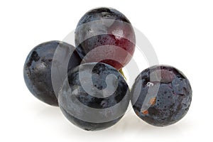 Fresh black grapes isolated on white