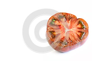 Fresh Black Russian Tomato Cut In Half On White Background