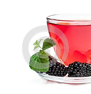 Fresh blackberry tea in glass cup isolated on white