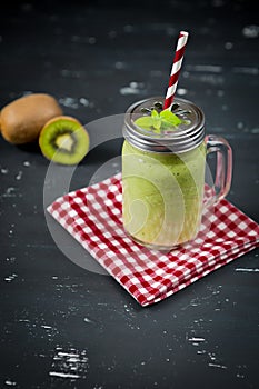Fresh blended green smoothie with kiwi and spinach