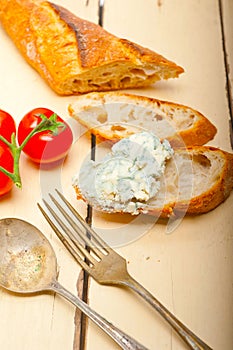 Fresh blue cheese spread ove french baguette