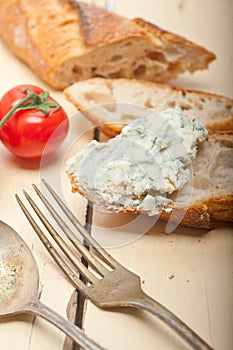 Fresh blue cheese spread ove french baguette