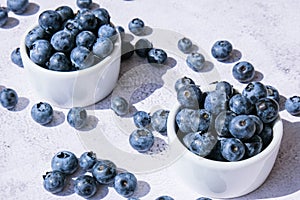 Fresh blueberries background with copy space. Blueberry antioxidant organic superfood in bowls concept for healthy