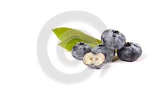Fresh blueberries Cyanococcus within the genus Vaccinium with sliced berry