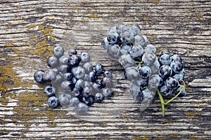 Fresh blueberries and grapes on wooden background