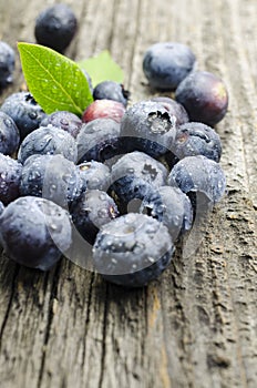 Fresh blueberries on old wood table