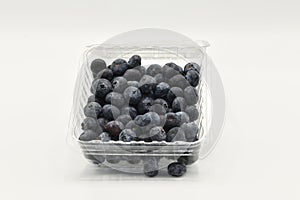 Fresh blueberries in a plastic container
