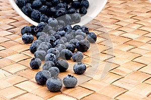 fresh blueberries spilling from a bowl