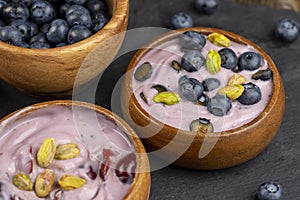 fresh blueberry-flavored yogurt with ripe blueberries and pistachios