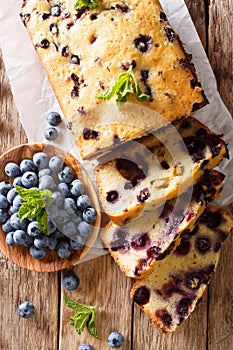 fresh blueberry loaf of bread muffin cake with mint closeup. vertical top view