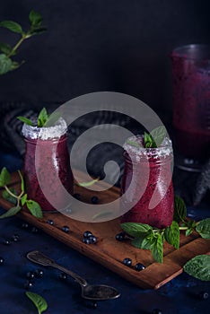 Fresh blueberry milkshake with mint herb