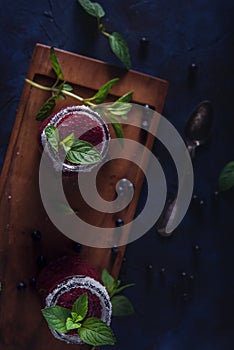 Fresh blueberry milkshake with mint herb